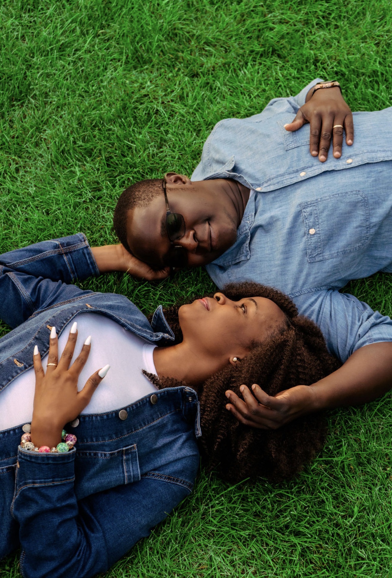 Lois and Peleg relaxing together on the grass